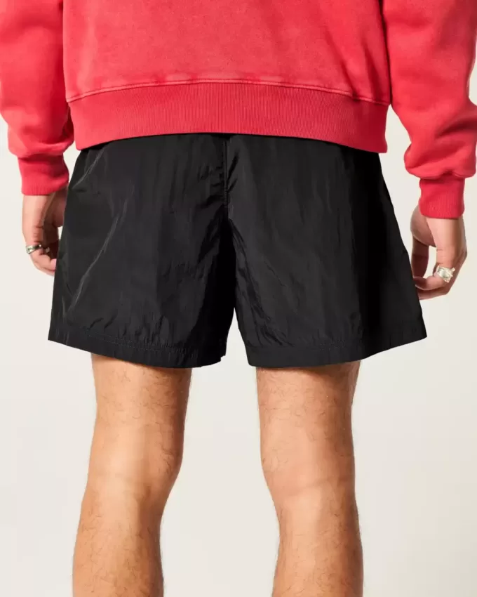 Baggy-Fußballshorts bis zur Mitte des Oberschenkels Baggy-Fußballshorts bis zur Mitte des Oberschenkels