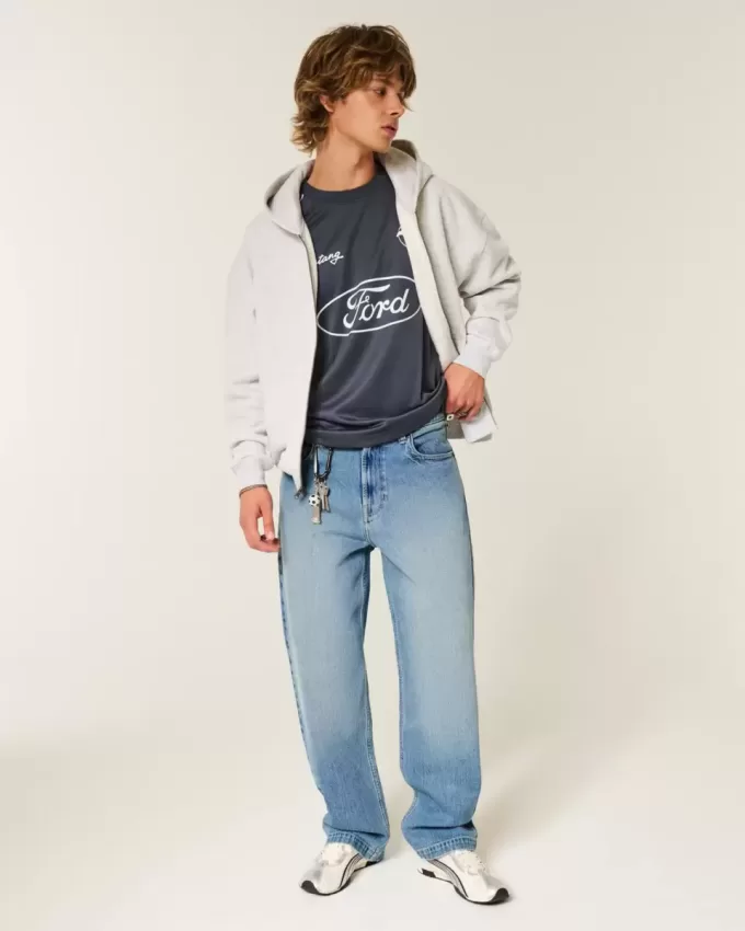 Baggy-Jeans mit Adler-Grafik in mittlerer Waschung