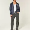 Baggy-Jeans mit verwaschenem Logo und Grafik in Schwarz