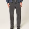 Baggy-Jeans mit verwaschenem Logo und Grafik in Schwarz