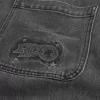 Baggy-Jeans mit verwaschenem Logo und Grafik in Schwarz