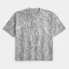 Boxy Crop Heavyweight T-Shirt mit Rundhalsausschnitt und Camouflage-Muster Boxy Crop Heavyweight T-Shirt mit Rundhalsausschnitt und Camouflage-Muster