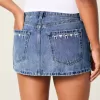 Curvy Low-Rise Mini-Jeansrock mit bestickter Schleife Curvy Low-Rise Mini-Jeansrock mit bestickter Schleife