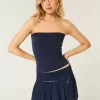 Gesmokter Mini-Skort mit Stufen Gesmokter Mini-Skort mit Stufen