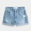High-Rise Ripped Denim Shortie Shorts in mittlerer heller Waschung High-Rise Ripped Denim Shortie Shorts in mittlerer heller Waschung