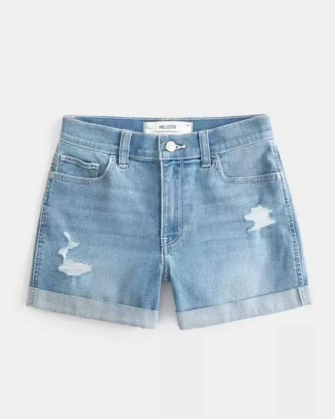 High-Rise Ripped Denim Shortie Shorts in mittlerer heller Waschung High-Rise Ripped Denim Shortie Shorts in mittlerer heller Waschung