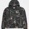 Kastenförmiger Kapuzenpullover mit Camouflage-Muster Kastenförmiger Kapuzenpullover mit Camouflage-Muster
