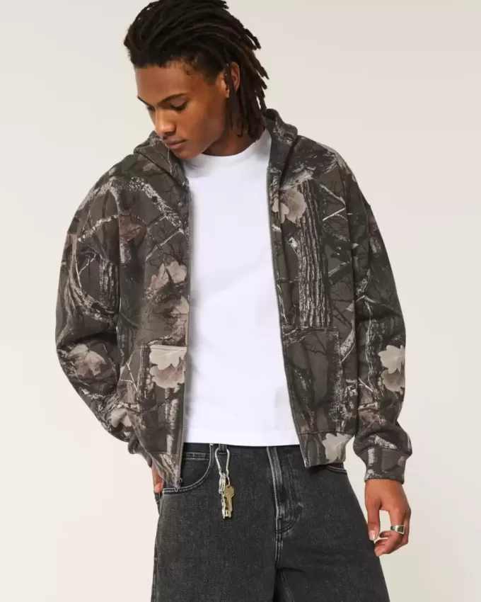 Kastenförmiger Kapuzenpullover mit Camouflage-Muster und Reißverschluss Kastenförmiger Kapuzenpullover mit Camouflage-Muster und Reißverschluss