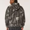 Kastenförmiger Kapuzenpullover mit Camouflage-Muster und Reißverschluss Kastenförmiger Kapuzenpullover mit Camouflage-Muster und Reißverschluss