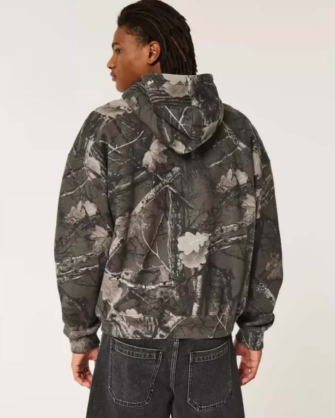 Kastenförmiger Kapuzenpullover mit Camouflage-Muster und Reißverschluss Kastenförmiger Kapuzenpullover mit Camouflage-Muster und Reißverschluss