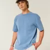 Kastenförmiges, schweres T-Shirt mit Rundhalsausschnitt aus gewaschener Baumwolle Kastenförmiges, schweres T-Shirt mit Rundhalsausschnitt aus gewaschener Baumwolle