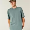 Kastenförmiges, schweres T-Shirt mit Rundhalsausschnitt aus gewaschener Baumwolle Kastenförmiges, schweres T-Shirt mit Rundhalsausschnitt aus gewaschener Baumwolle