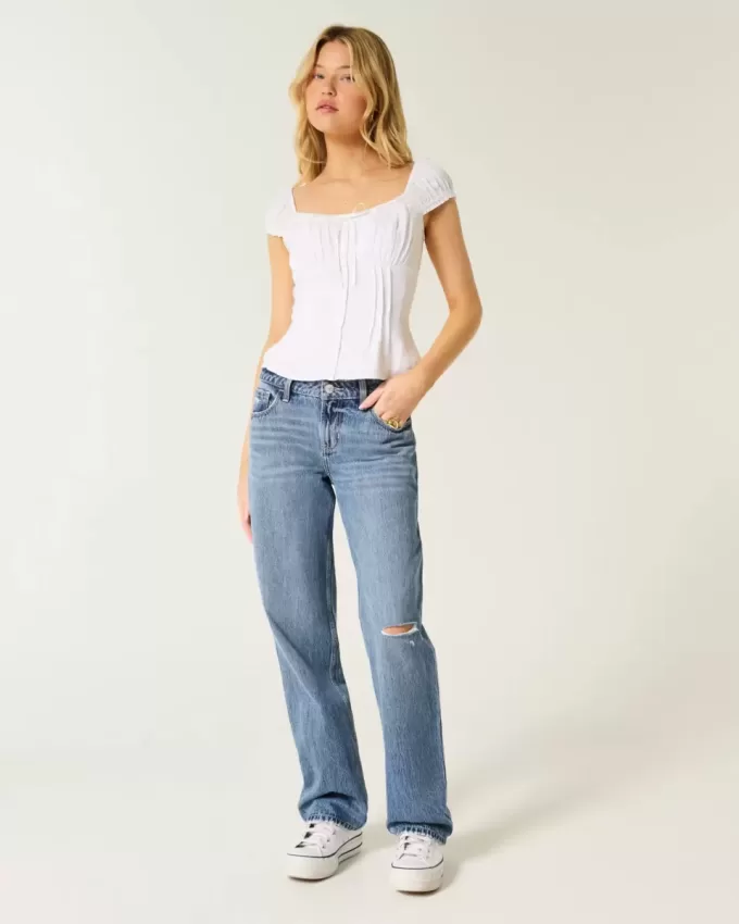 Lockere Jeans mit niedrigem Bund und Rissen in mittlerer Waschung Lockere Jeans mit niedrigem Bund und Rissen in mittlerer Waschung