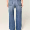 Low-Rise Baggy-Jeans mit mittlerer Waschung und Nietenherzen Low-Rise Baggy-Jeans mit mittlerer Waschung und Nietenherzen