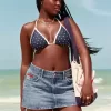 Low-Rise-Mini-Skort aus Denim mit mittlerer Waschung und Flaggenstickerei Low-Rise-Mini-Skort aus Denim mit mittlerer Waschung und Flaggenstickerei