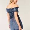 Low-Rise-Mini-Skort aus Denim mit mittlerer Waschung und Flaggenstickerei Low-Rise-Mini-Skort aus Denim mit mittlerer Waschung und Flaggenstickerei