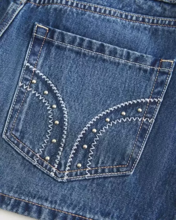 Low-Rise-Mini-Skort aus Denim mit Nieten