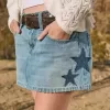 Low-Rise-Mini-Skort aus Denim mit Stern-Applikation in mittlerer Waschung Low-Rise-Mini-Skort aus Denim mit Stern-Applikation in mittlerer Waschung
