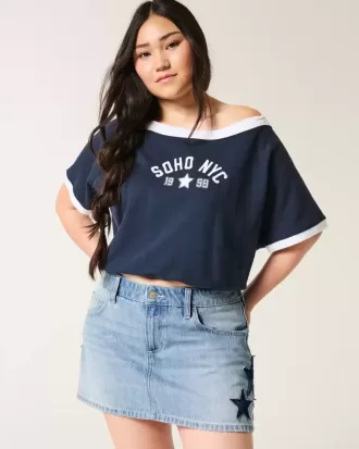 Low-Rise-Mini-Skort aus Denim mit Stern-Applikation in mittlerer Waschung