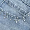 Mini-Skort aus Denim in heller Waschung mit Nieten