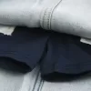 Mini-Skort aus Denim mit heller Waschung und Schnürsenkeln Mini-Skort aus Denim mit heller Waschung und Schnürsenkeln