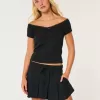 Mittelhoher, plissierter Mini-Skort