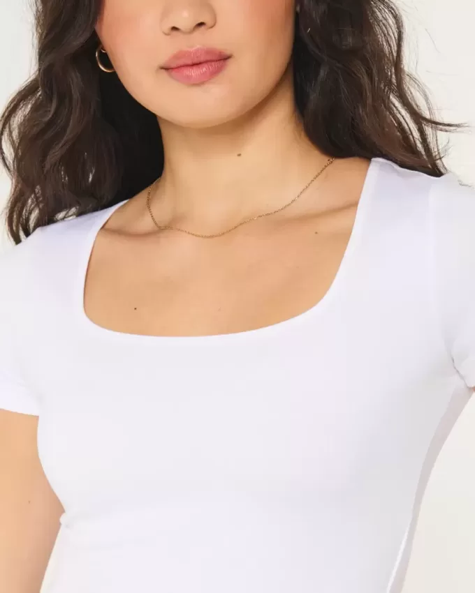 Nahtloses Baby-T-Shirt aus Stoff mit quadratischem Ausschnitt Nahtloses Baby-T-Shirt aus Stoff mit quadratischem Ausschnitt