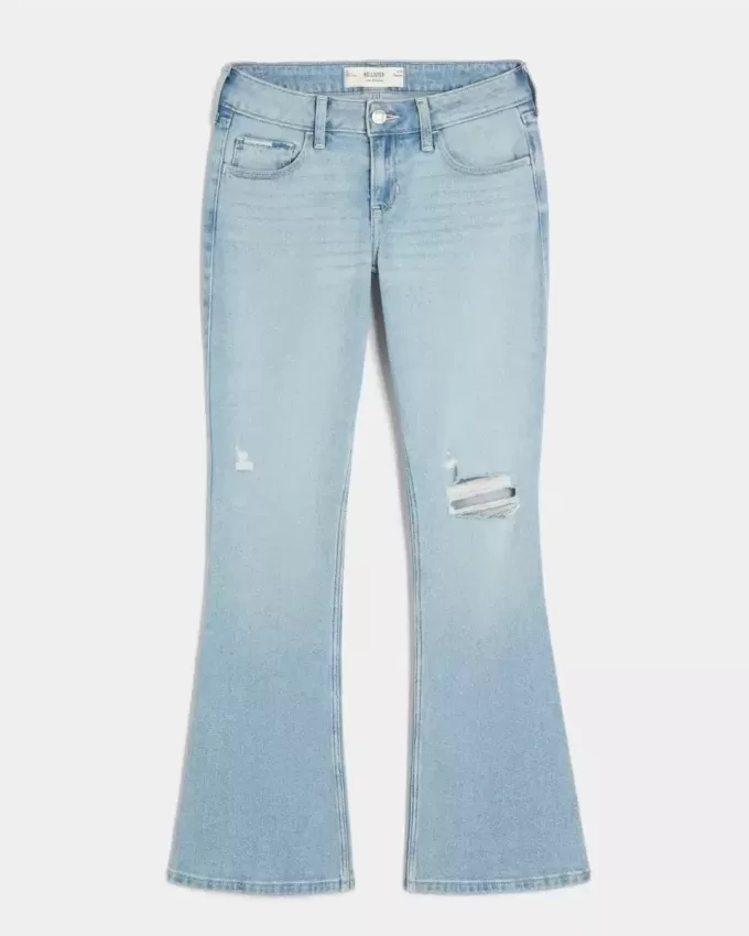 Niedrig geschnittene, zerrissene Bootcut-Jeans in heller Waschung mit Stickerei Niedrig geschnittene, zerrissene Bootcut-Jeans in heller Waschung mit Stickerei