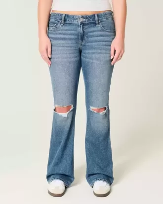 Niedrig sitzende Bootcut-Jeans mit Rissen in mittlerer Waschung