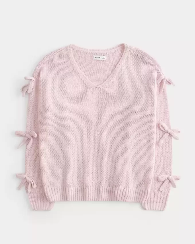 Schulterfreier Pullover mit Schleifenapplikation Schulterfreier Pullover mit Schleifenapplikation
