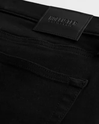 Schwarze, nicht verblassende, sportliche Skinny-Jeans