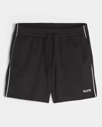 Strick-Fußballshorts mit Logo bis zur Mitte des Oberschenkels