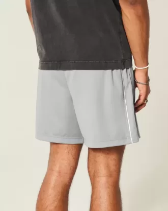Strick-Fußballshorts mit Logo bis zur Mitte des Oberschenkels