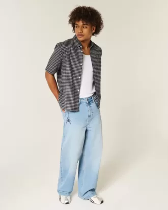 Super Baggy-Jeans mit Spider-Grafik in heller Waschung