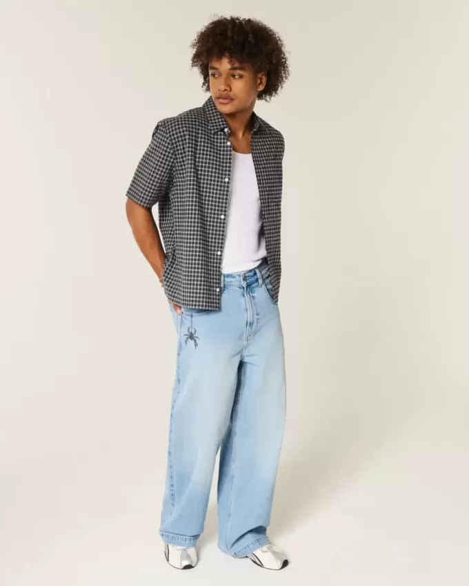 Super Baggy-Jeans mit Spider-Grafik in heller Waschung