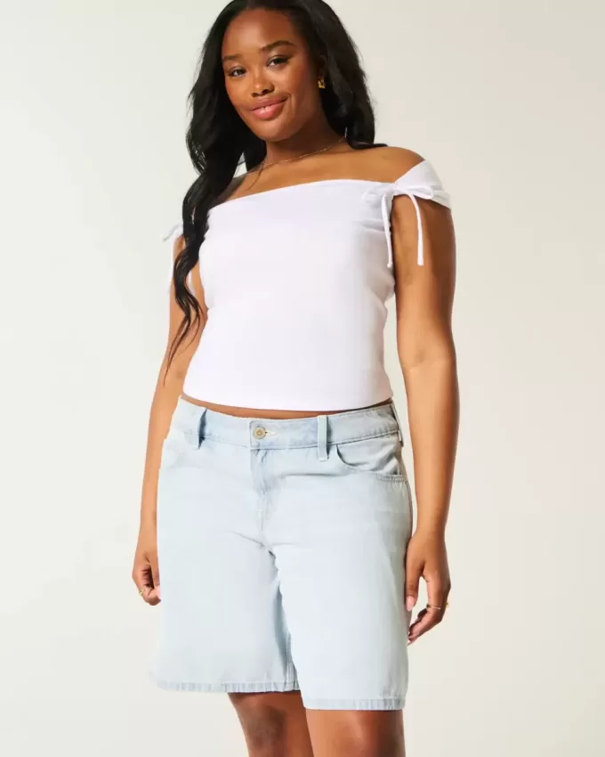 Tief sitzende Baggy-Jeans mit heller Waschung und Schleifengrafik