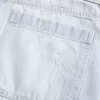 Tief sitzende Baggy-Jeans mit heller Waschung und Schleifengrafik