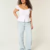 Tief sitzende Baggy-Jeans mit heller Waschung und Sternstickerei