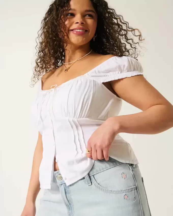 Tief sitzende Baggy-Jeans mit heller Waschung und Sternstickerei