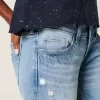 Ultra Low-Rise Distressed Light Wash Flare Jeans mit Pailletten