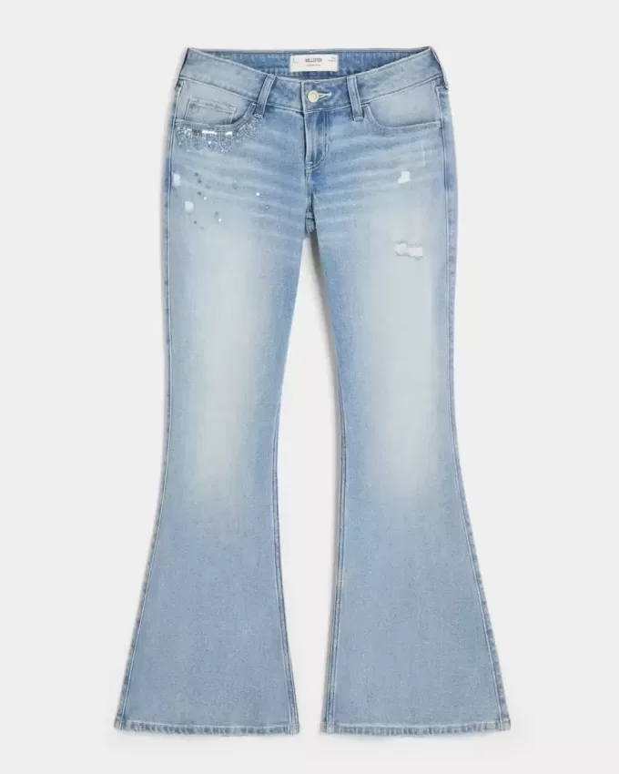 Ultra Low-Rise Distressed Light Wash Flare Jeans mit Pailletten