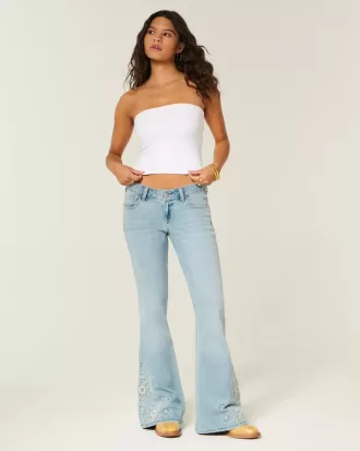 Ultra Low Rise Schlagjeans mit heller Waschung und Blumenstickerei