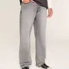 Verwaschene schwarze Baggy-Jeans mit Grafik und Verzierung Verwaschene schwarze Baggy-Jeans mit Grafik und Verzierung