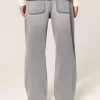 Verwaschene schwarze Baggy-Jeans mit Grafik und Verzierung Verwaschene schwarze Baggy-Jeans mit Grafik und Verzierung