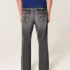 Verwaschene schwarze bestickte Baggy-Bootcut-Jeans