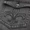 Verwaschene schwarze bestickte Baggy-Bootcut-Jeans