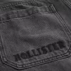 Verwaschene schwarze Skater-Baggy-Jeans mit Logo-Grafik