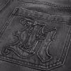 Verwaschene schwarze Skater-Baggy-Jeans mit Logo-Grafik