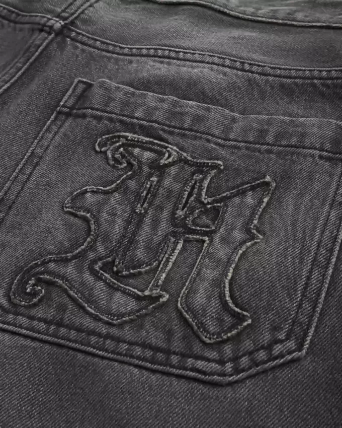 Verwaschene schwarze Skater-Baggy-Jeans mit Logo-Grafik