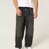 Verwaschene schwarze Skater-Baggy-Jeans mit Schlangenstickerei